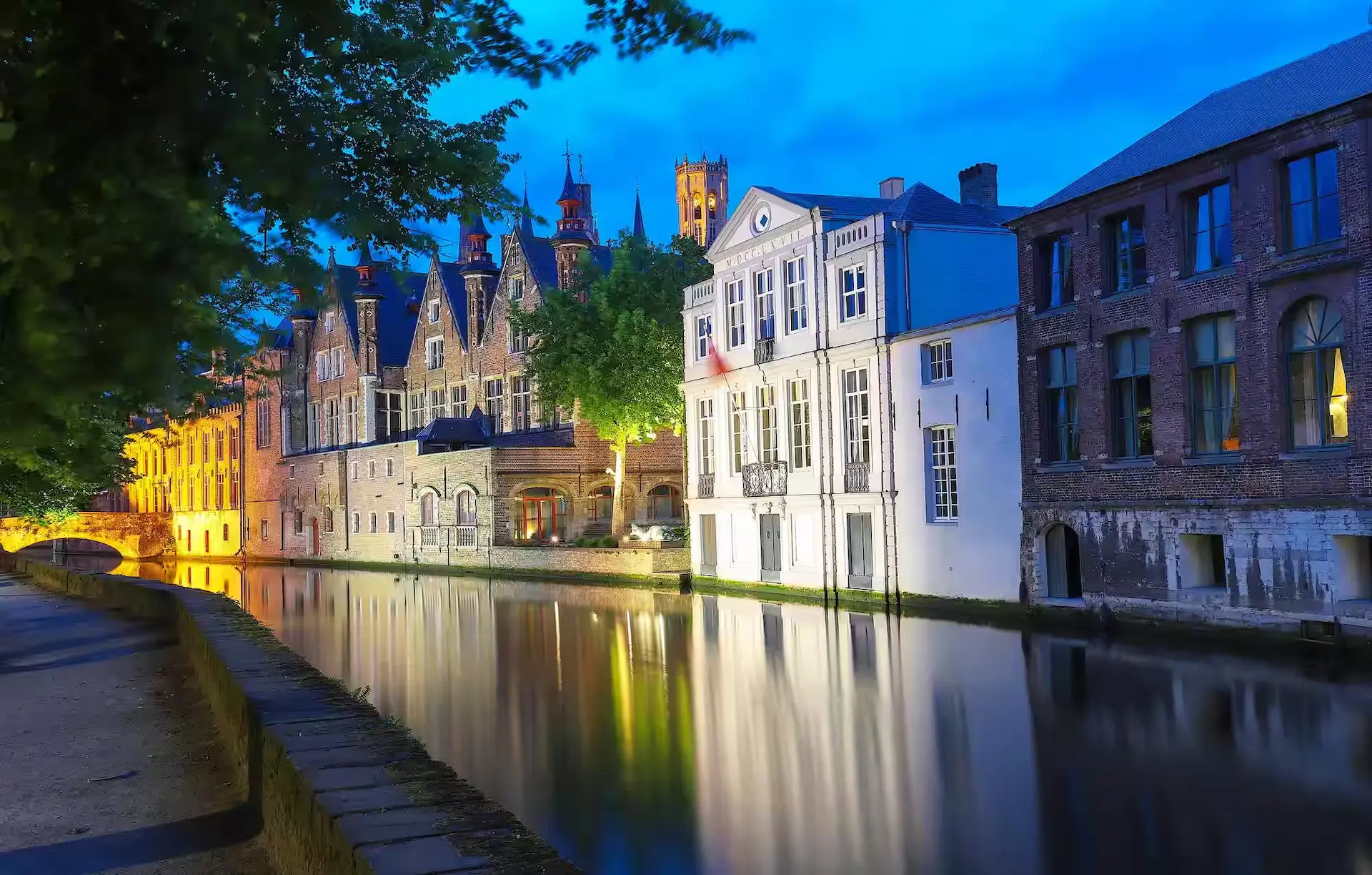 Scenic city view of bruges canal with beautiful medieval colored houses Scenic city view of bruges canal with beautiful medieval colored houses